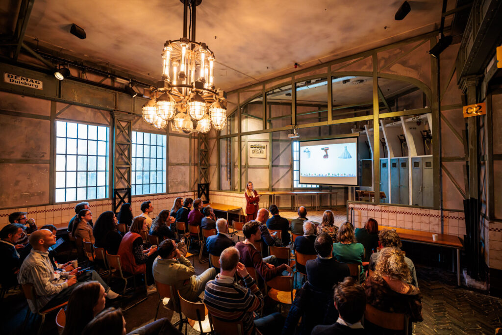 Photo of Nienke presenting on sharing economy