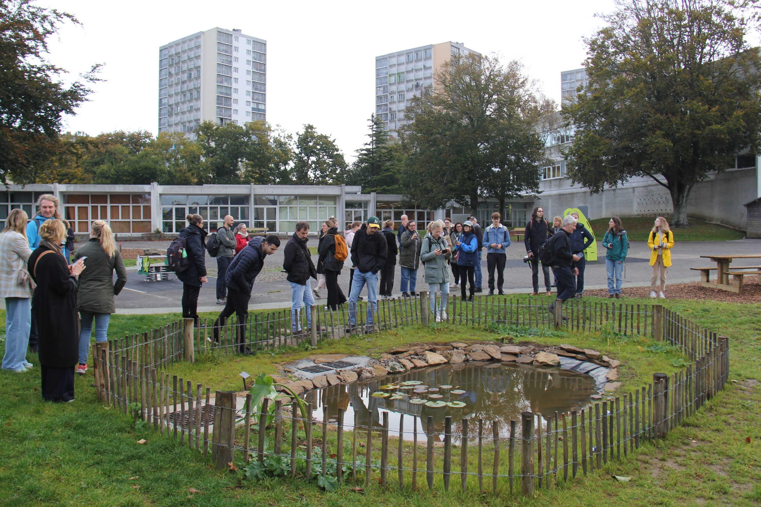 Photo of Biodiverse Cities project partners going to see new pond in Brest schoolyard